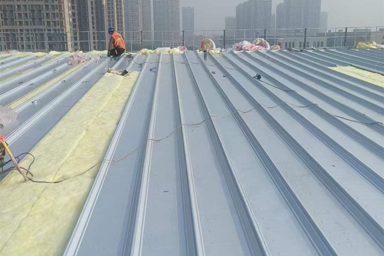 Installation of Fiberglass Insulation Rolls